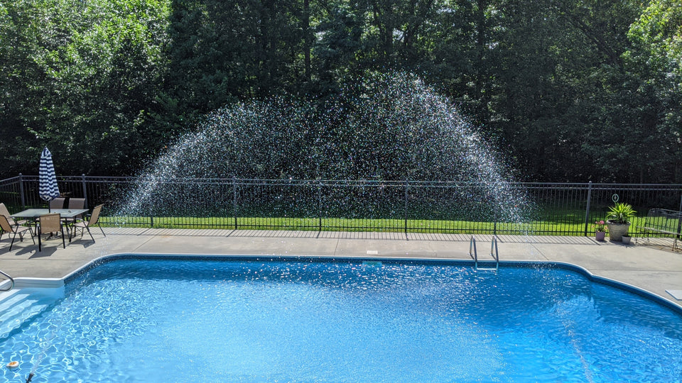KYP pool coolers spray into swimming pool lowering water temperatures in hot summer months